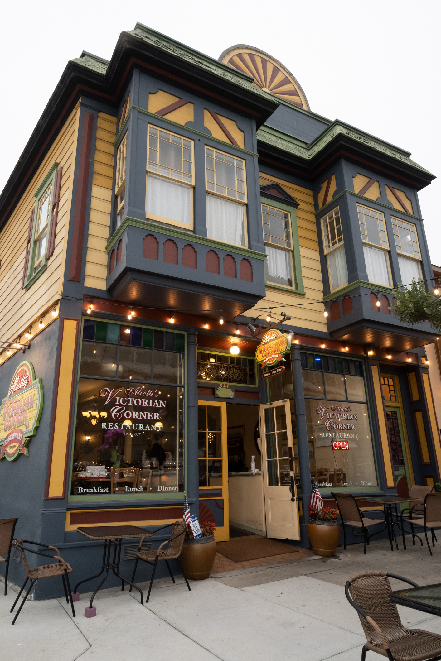 Front view of a Victorian style house turned restaurant in Pacific Grove, CA.