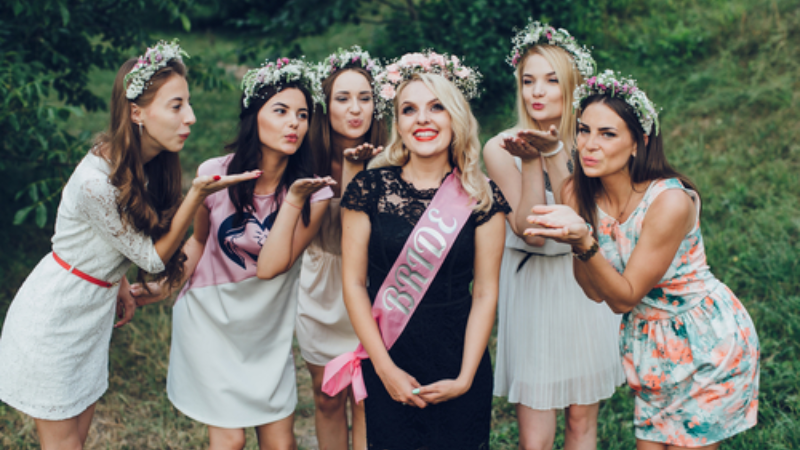 Girlfriends and bride celebrate her bachelorette party before the wedding at a winery.