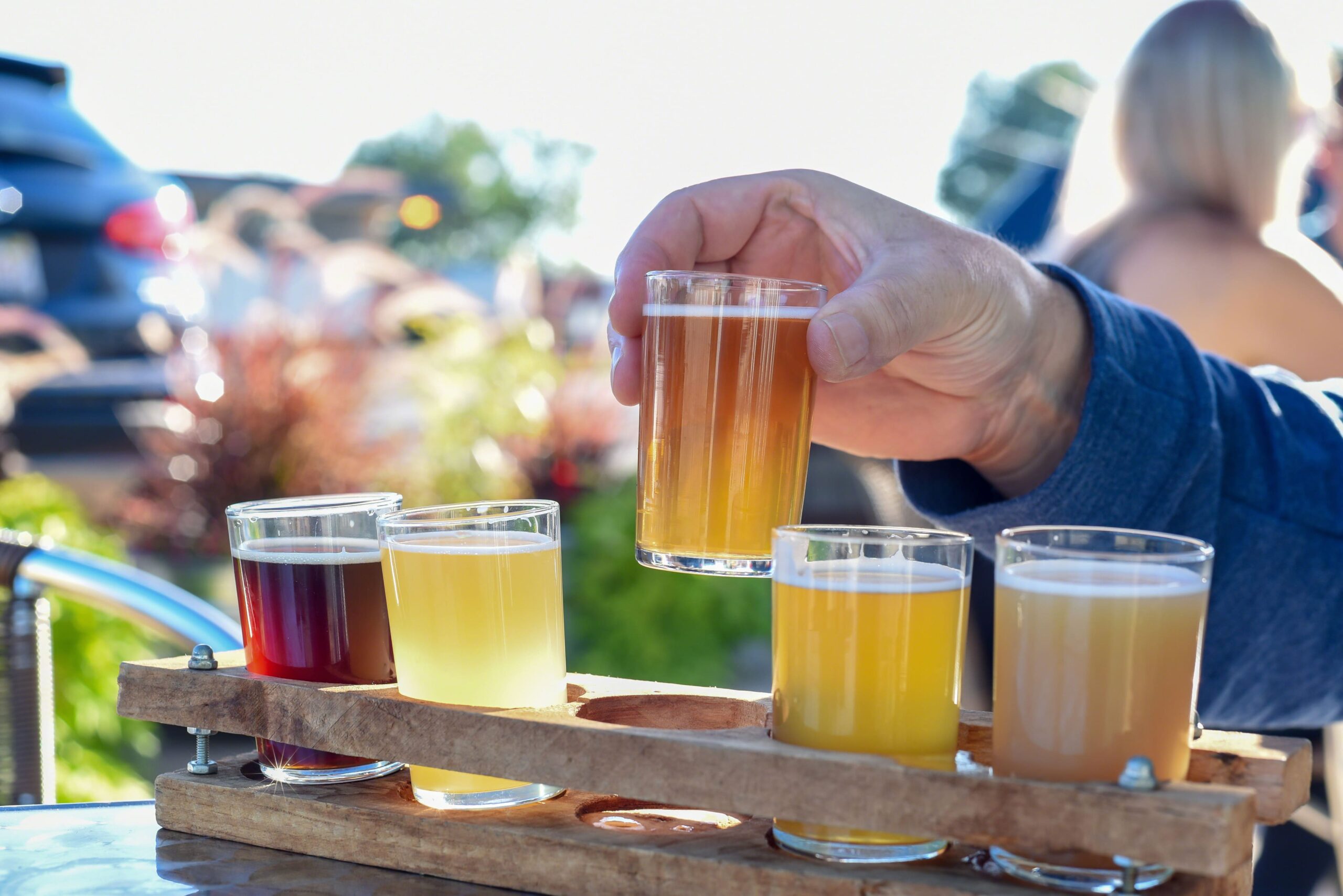 Man sampling a variety of seasonal craft beer at a microbrewery in Sonoma County, CA.