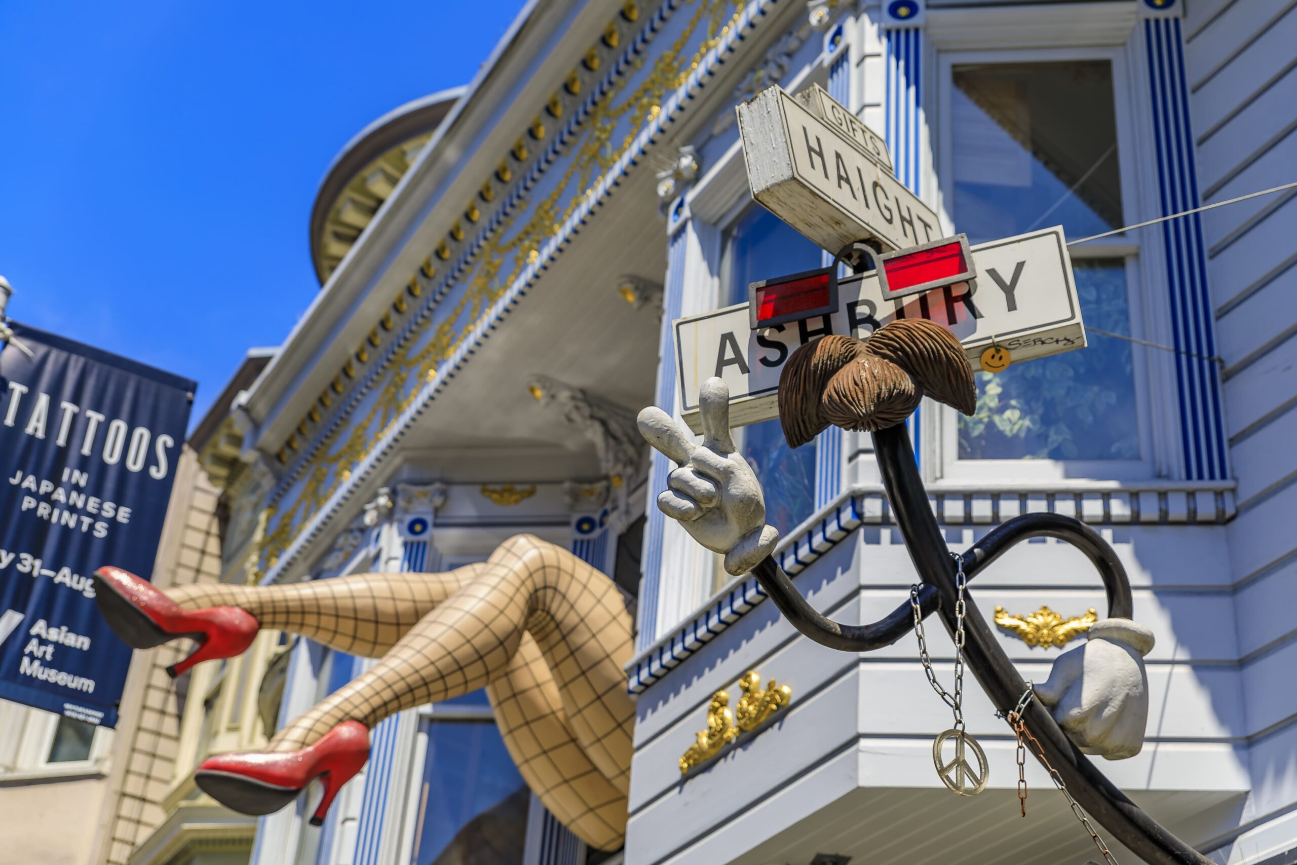 Iconic sculpture with female legs in fishnet stockings and red heels in a window in Haight Ashbury neighborhood in San Francisco, CA.<br />
