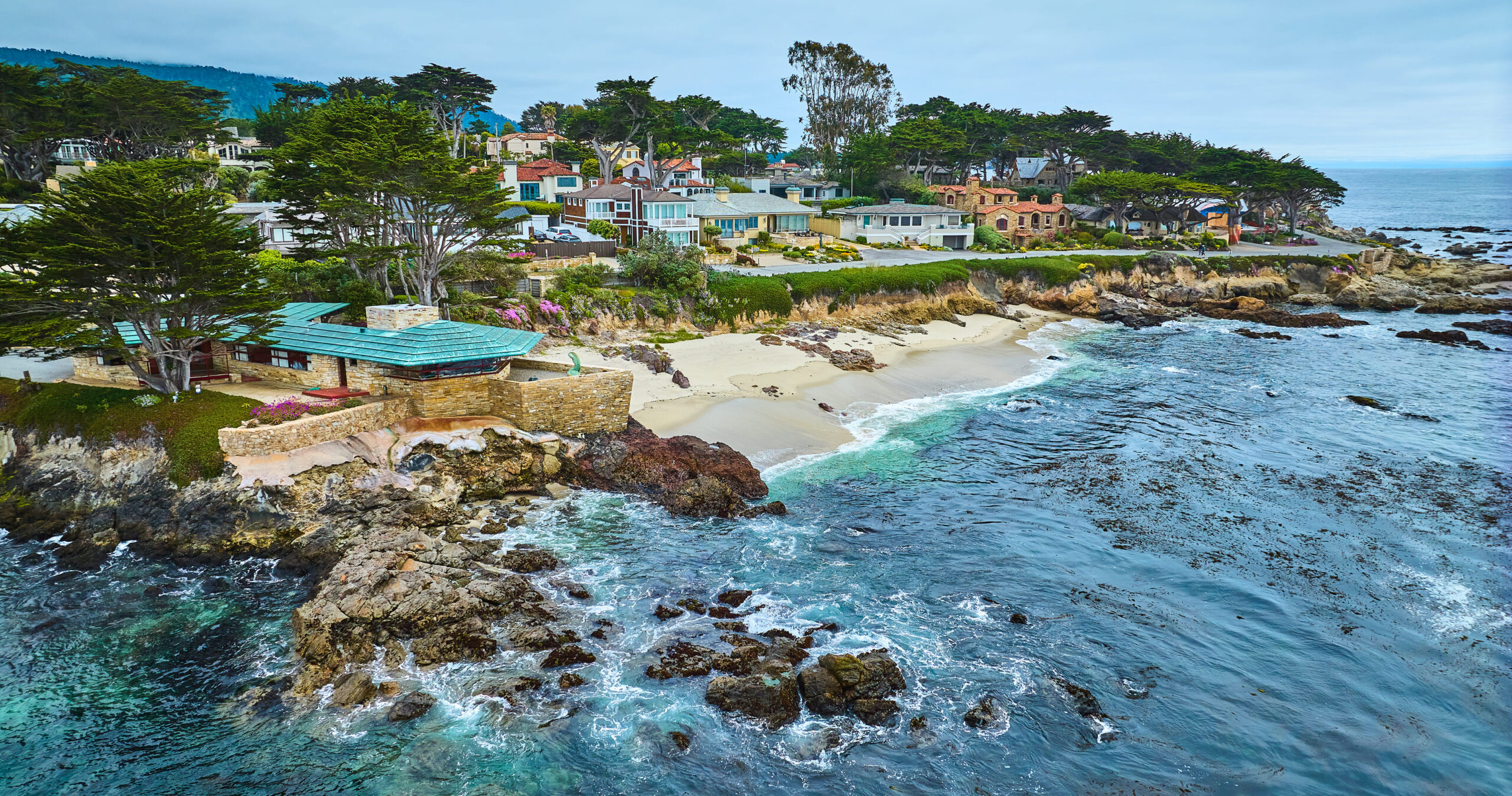 Image of Aerial Clinton Walker House by Frank Lloyd Wright and Carmel Beach with houses in the small town of Carmel-by-the-Sea.